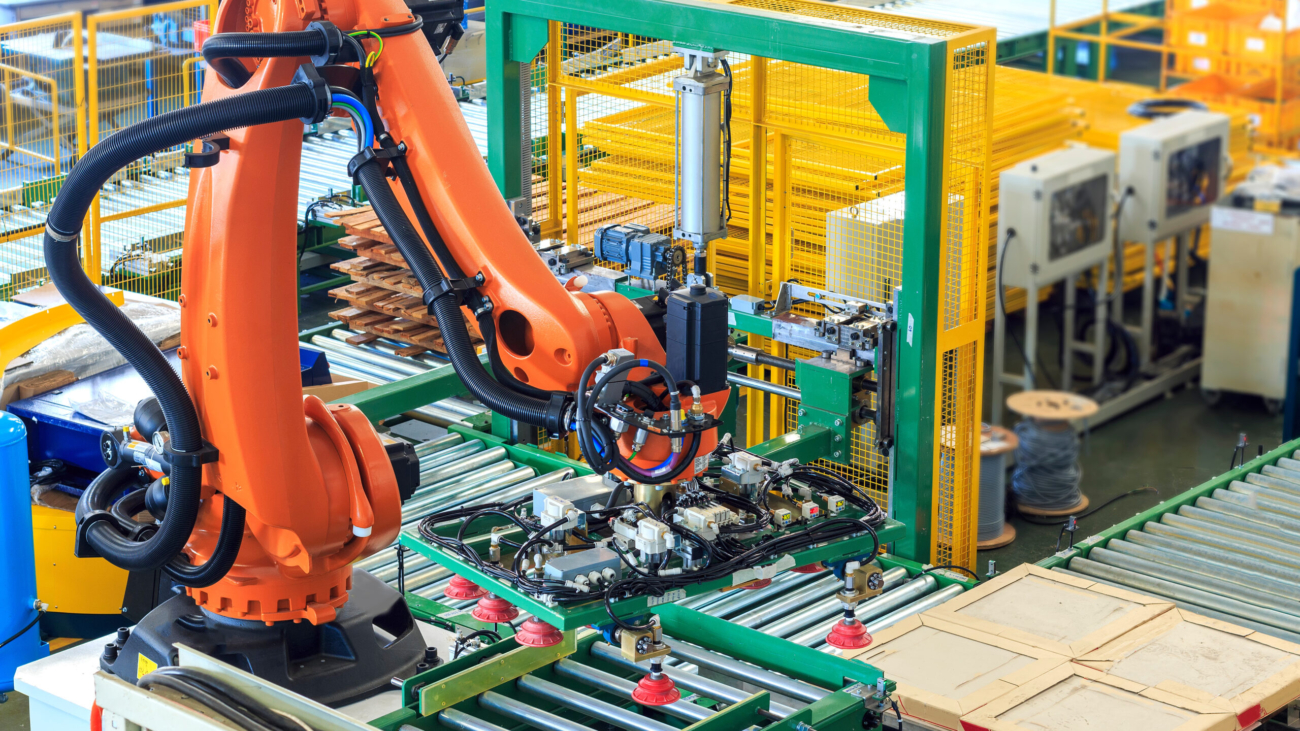 Factory 4.0 concept. Industrial robot in smart warehouse system